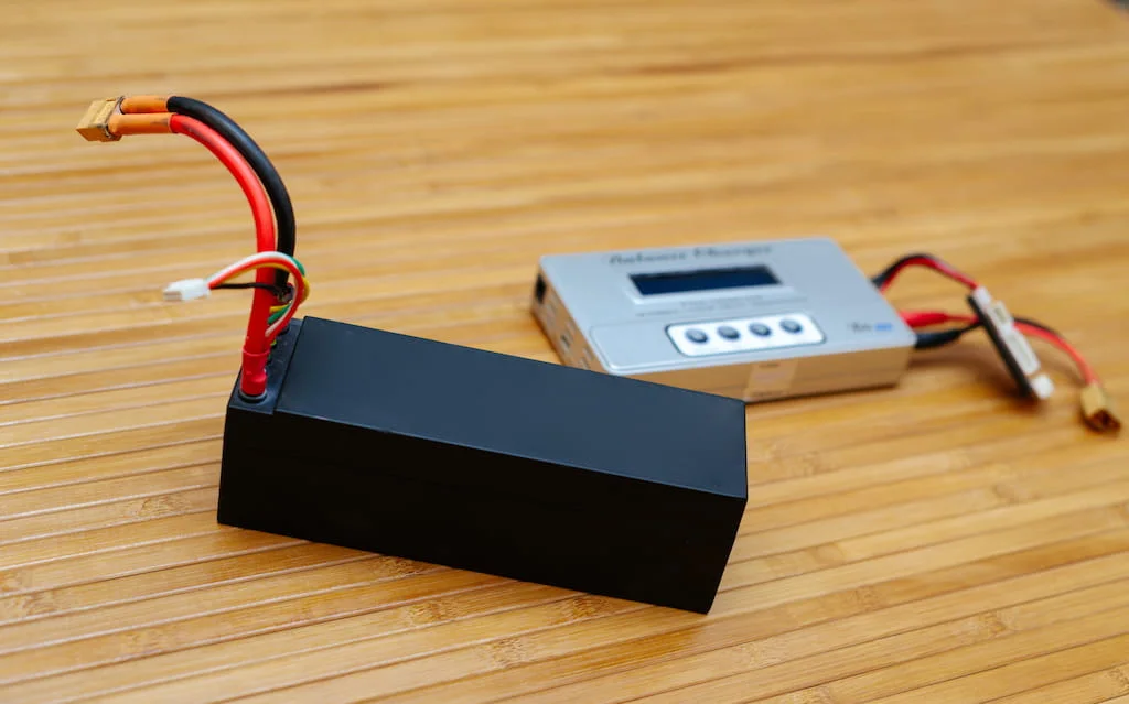 LiPo battery and charger on a table
