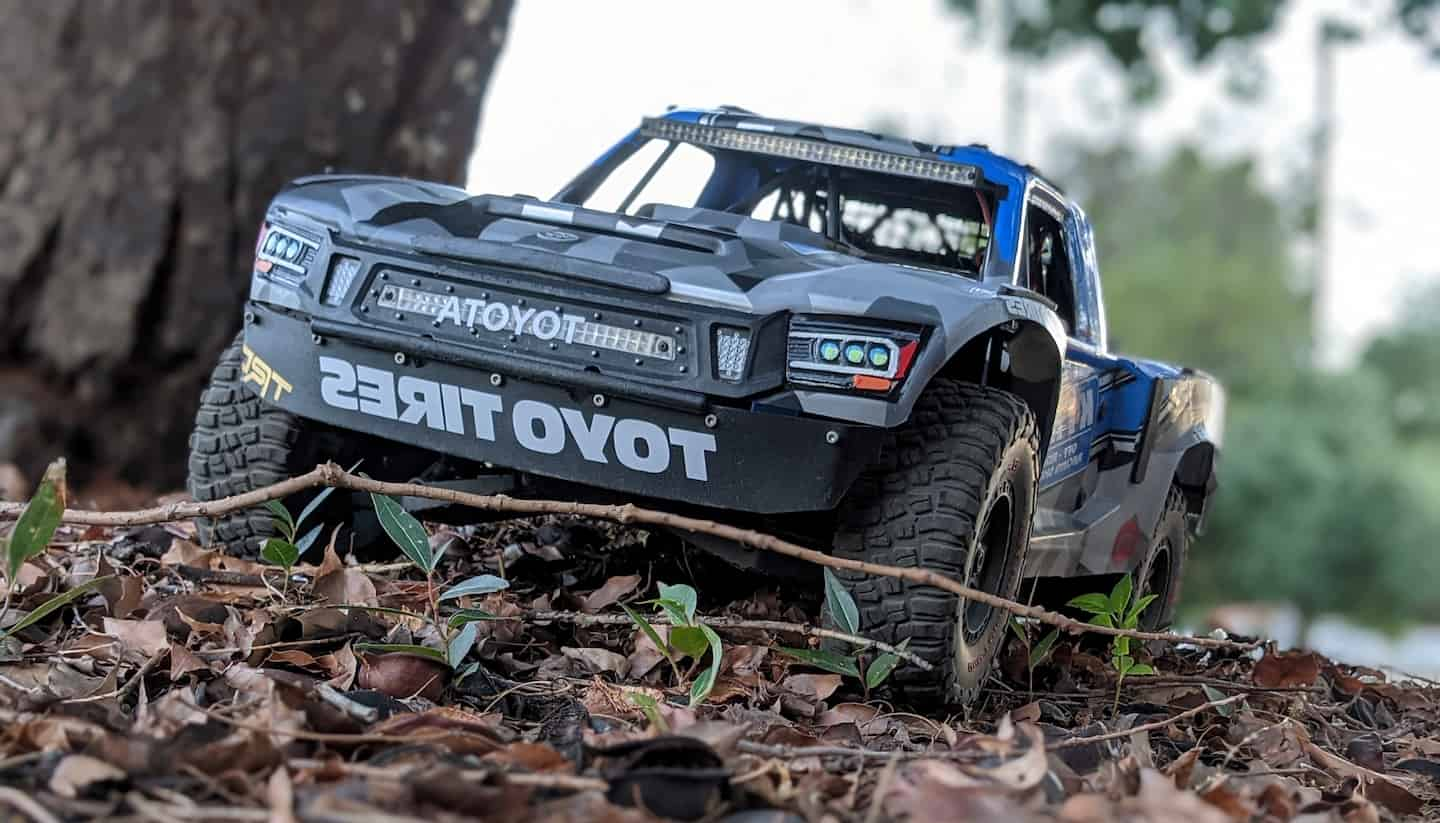 close up of rc stadium truck in the leaves