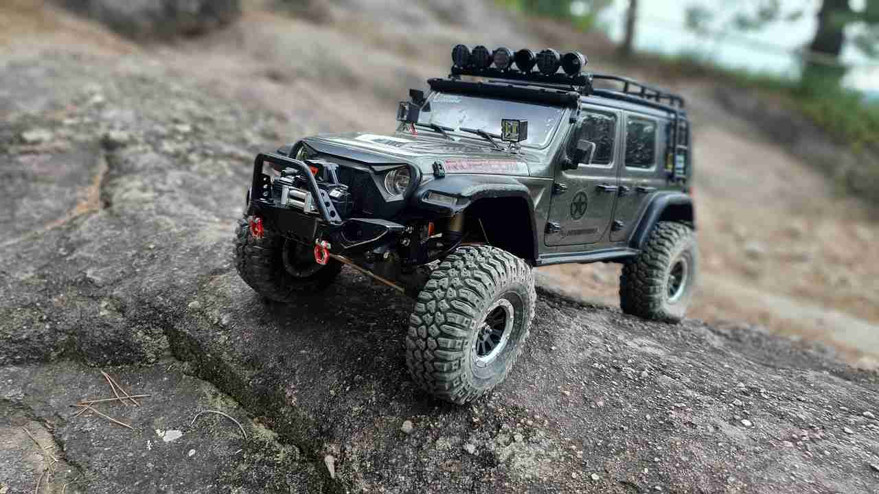 small rock crawler rc jeep on a large rock