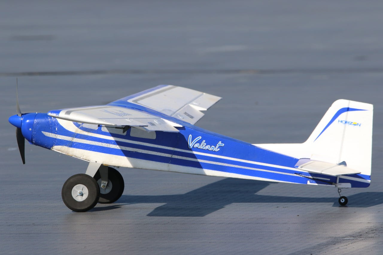 best rc planes for beginners feature image of a blue trainer plane
